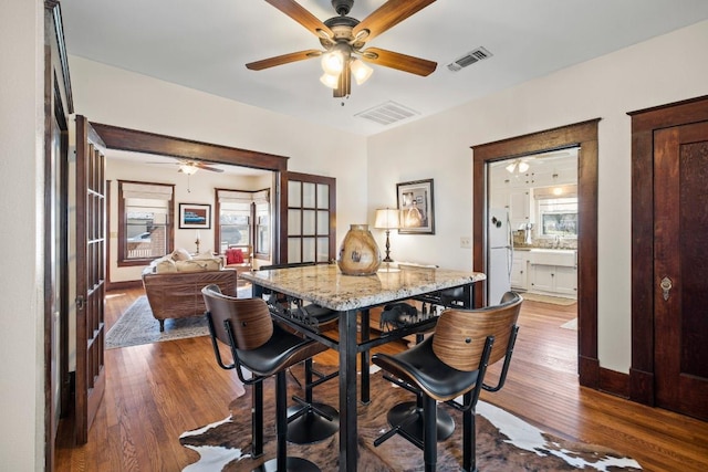 306 S Market St, Flatonia, TX 78941 - dining room featuring a ceiling fan and wood finished floors