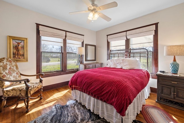 306 S Market St, Flatonia, TX 78941 - bedroom with wood finished floors and ceiling fan