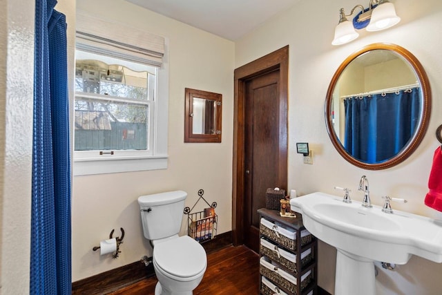 306 S Market St, Flatonia, TX 78941 - full bath with wood finished floors and toilet