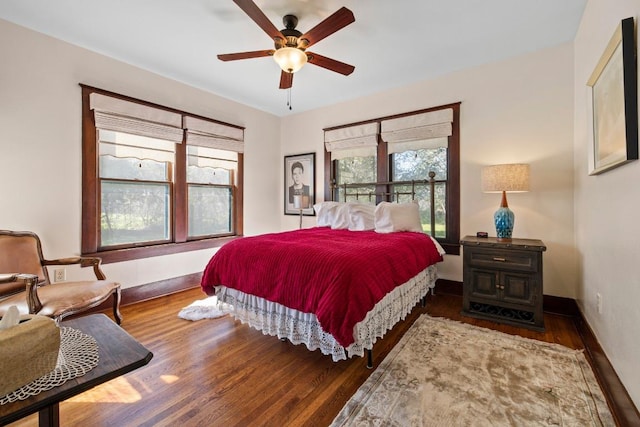 306 S Market St, Flatonia, TX 78941 - bedroom with multiple windows, wood finished floors, and a ceiling fan