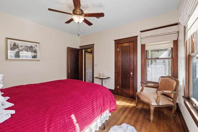 306 S Market St, Flatonia, TX 78941 - bedroom with wood finished floors and a ceiling fan