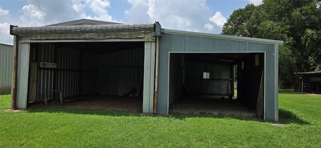 291 Reids Bnd, Bastrop, TX 78602 - view of pole building with a lawn