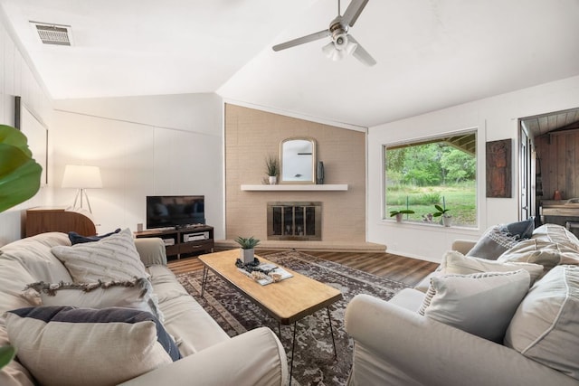 8604 Granada Hills Dr, Austin, TX 78737 - living room featuring vaulted ceiling, a ceiling fan, wood finished floors, and a brick fireplace