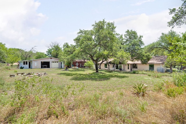 8604 Granada Hills Dr, Austin, TX 78737 - view of green lawn with an outbuilding