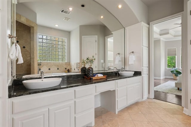 27 Autumn Oaks Dr, The Hills, TX 78738 - bathroom featuring double vanity, recessed lighting, crown molding, and tile patterned floors