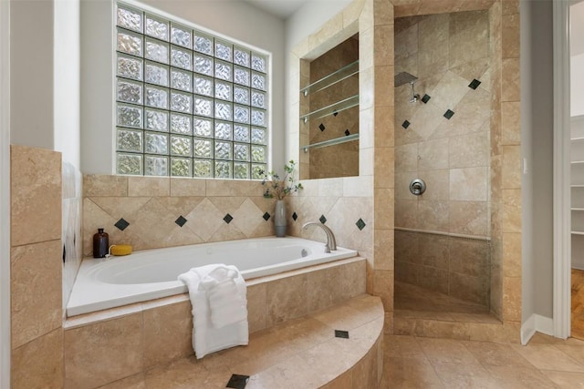 27 Autumn Oaks Dr, The Hills, TX 78738 - bathroom with a garden tub, tiled shower, and tile patterned floors