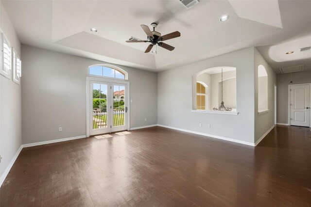 27 Autumn Oaks Dr, The Hills, TX 78738 - empty room with a tray ceiling, ceiling fan, dark wood-style flooring, recessed lighting, and attic access