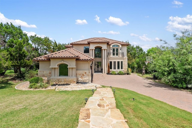 27 Autumn Oaks Dr, The Hills, TX 78738 - mediterranean / spanish-style home with stone siding, stucco siding, driveway, and a front yard