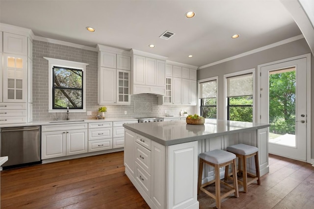 27 Autumn Oaks Dr, The Hills, TX 78738 - kitchen featuring dishwasher, ornamental molding, plenty of natural light, white cabinets, and recessed lighting