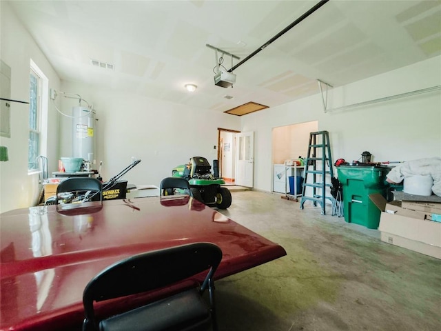 204 Matthew Cv, Bastrop, TX 78602 - garage featuring electric water heater and a garage door opener