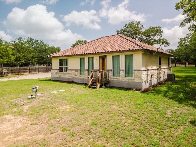 204 Matthew Cv, Bastrop, TX 78602 - rear view of house with a tiled roof
