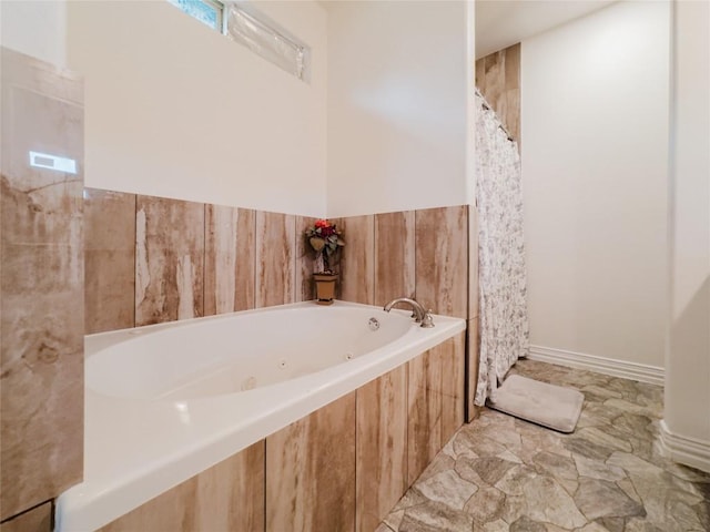 204 Matthew Cv, Bastrop, TX 78602 - full bathroom featuring a jetted tub and a shower with shower curtain