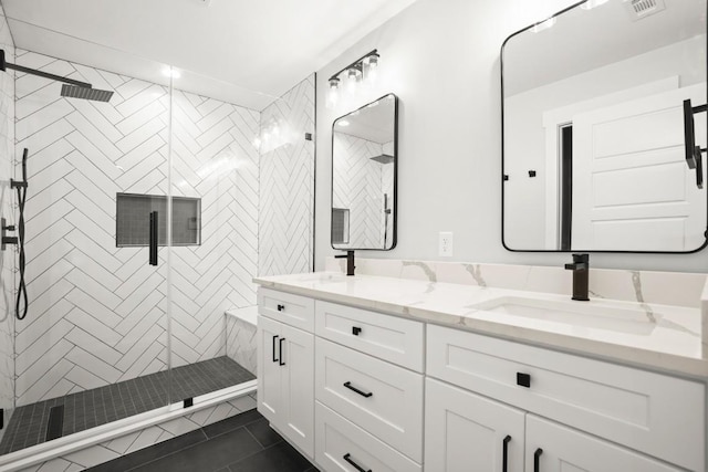 11615 February Dr, Austin, TX 78753 - full bath with double vanity, a stall shower, and tile patterned flooring