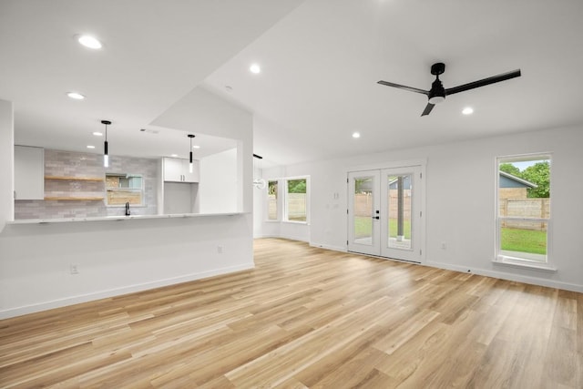 11615 February Dr, Austin, TX 78753 - unfurnished living room with a ceiling fan, light wood finished floors, recessed lighting, and healthy amount of natural light