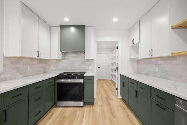 11615 February Dr, Austin, TX 78753 - kitchen with green cabinets, gas range, custom range hood, white cabinets, and recessed lighting