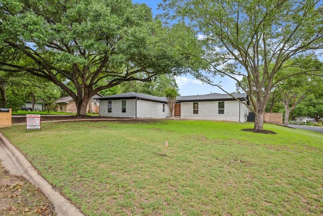 11615 February Dr, Austin, TX 78753 - view of front of home with a front yard