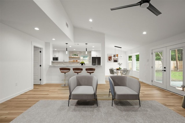 11615 February Dr, Austin, TX 78753 - living room featuring french doors, light wood-style flooring, lofted ceiling, ceiling fan, and recessed lighting