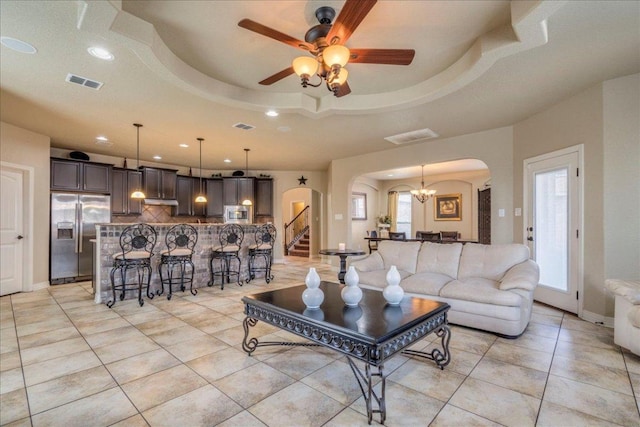 913 Overcup Dr, San Marcos, TX 78666 - living area with arched walkways, recessed lighting, light tile patterned floors, a ceiling fan, and stairway