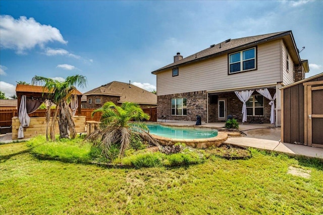 913 Overcup Dr, San Marcos, TX 78666 - rear view of property featuring a fenced backyard, a patio, a chimney, brick siding, and a gazebo