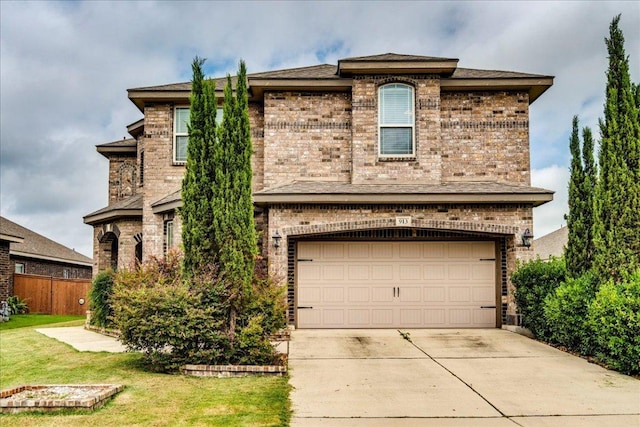 913 Overcup Dr, San Marcos, TX 78666 - view of front facade featuring brick siding, a garage, and concrete driveway