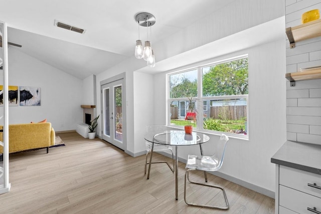 4712 Carsonhill Dr, Austin, TX 78723 - dining area with light wood-type flooring and vaulted ceiling