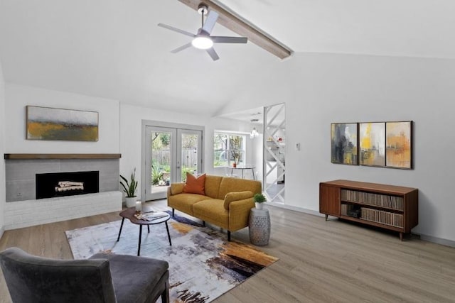 4712 Carsonhill Dr, Austin, TX 78723 - living room with wood finished floors, a ceiling fan, and a fireplace