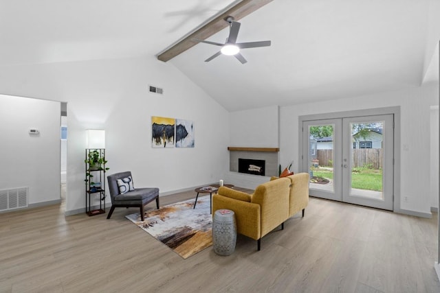 4712 Carsonhill Dr, Austin, TX 78723 - living room with light wood-style flooring, beamed ceiling, french doors, a ceiling fan, and high vaulted ceiling