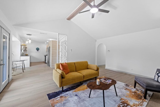 4712 Carsonhill Dr, Austin, TX 78723 - living room featuring light wood finished floors, ceiling fan, and arched walkways