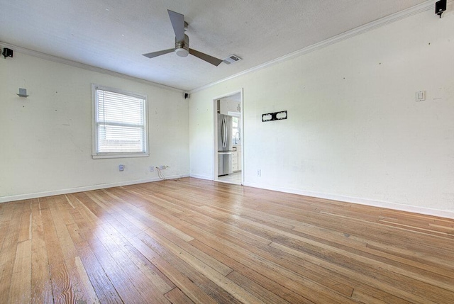 3303 Hollywood Ave, Austin, TX 78722 - empty room with ceiling fan, light wood-style flooring, and crown molding