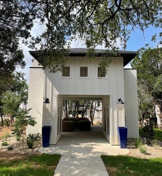 12001 Vista Parke Dr Unit 1002, Austin, TX 78726 - exterior space featuring a carport, board and batten siding, and driveway