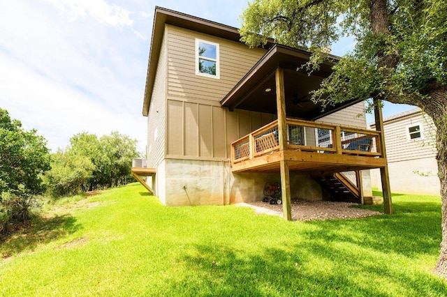 302 Castlehigh Dr, Granite Shoals, TX 78654 - rear view of house featuring board and batten siding, stairs, a deck, and a lawn