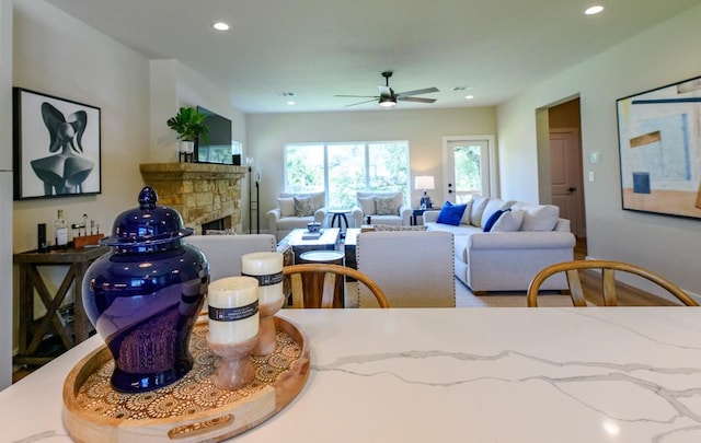 302 Castlehigh Dr, Granite Shoals, TX 78654 - living room featuring ceiling fan, a stone fireplace, and recessed lighting
