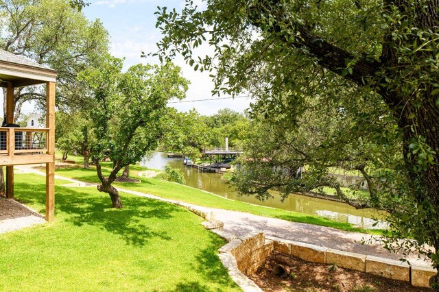 302 Castlehigh Dr, Granite Shoals, TX 78654 - view of property's community with a water view and a lawn
