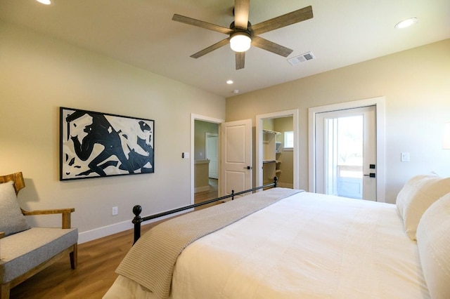 302 Castlehigh Dr, Granite Shoals, TX 78654 - bedroom with wood finished floors, recessed lighting, a walk in closet, and a ceiling fan