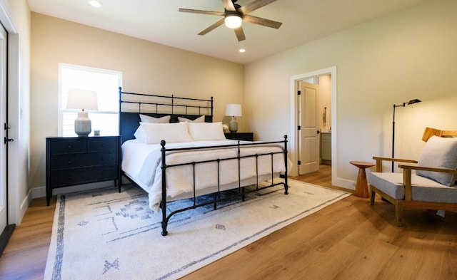 302 Castlehigh Dr, Granite Shoals, TX 78654 - bedroom featuring light wood-type flooring, recessed lighting, and ensuite bathroom
