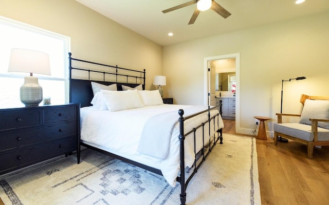 302 Castlehigh Dr, Granite Shoals, TX 78654 - bedroom with light wood finished floors, recessed lighting, ensuite bathroom, and a ceiling fan