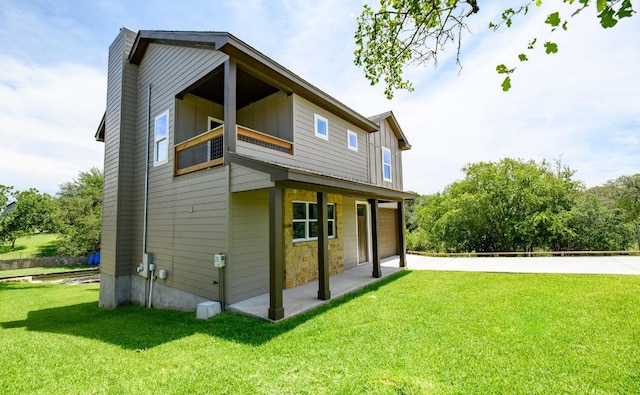 302 Castlehigh Dr, Granite Shoals, TX 78654 - view of side of home with a lawn, an attached garage, board and batten siding, and stone siding