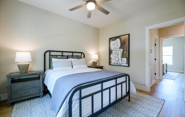 302 Castlehigh Dr, Granite Shoals, TX 78654 - bedroom featuring wood finished floors, a ceiling fan, and vaulted ceiling