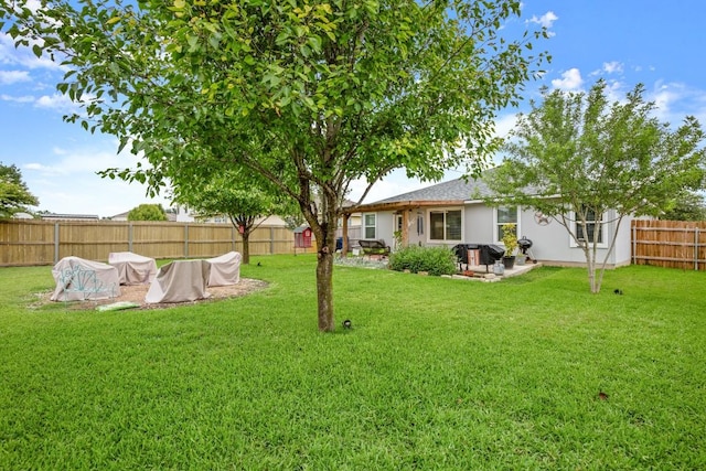 124 Phillips St, Hutto, TX 78634 - fenced backyard featuring a patio