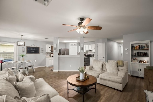 124 Phillips St, Hutto, TX 78634 - living room with a ceiling fan and dark wood finished floors
