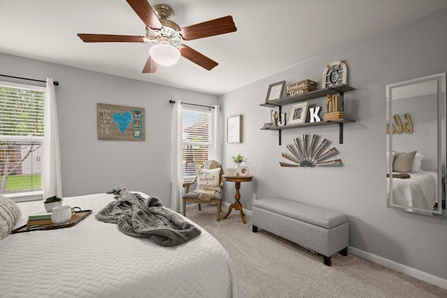124 Phillips St, Hutto, TX 78634 - carpeted bedroom featuring multiple windows and a ceiling fan
