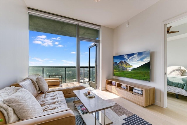 44 E Ave Unit 1909, Austin, TX 78701 - living room featuring expansive windows and light wood finished floors