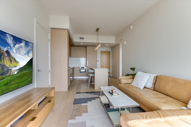 44 E Ave Unit 1909, Austin, TX 78701 - living room with light wood finished floors