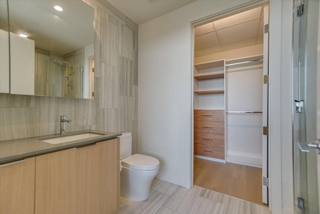 44 E Ave Unit 1909, Austin, TX 78701 - full bath with vanity, tasteful backsplash, and a shower