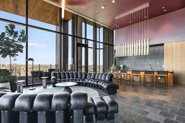 44 E Ave Unit 1909, Austin, TX 78701 - building lobby featuring a towering ceiling, a wall of windows, and recessed lighting