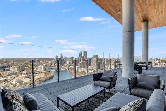 44 E Ave Unit 1909, Austin, TX 78701 - view of patio featuring a view of city, outdoor lounge area, and a water view