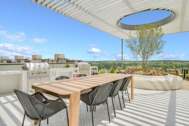 44 E Ave Unit 1909, Austin, TX 78701 - view of patio with an outdoor kitchen and outdoor dining area