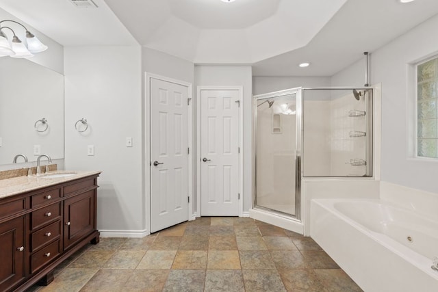 703 Amy Cir, Marble Falls, TX 78654 - full bathroom featuring a shower stall, vanity, a bath, stone finish flooring, and recessed lighting