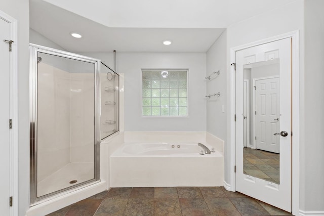 703 Amy Cir, Marble Falls, TX 78654 - full bath with a garden tub, a stall shower, recessed lighting, and stone finish floors