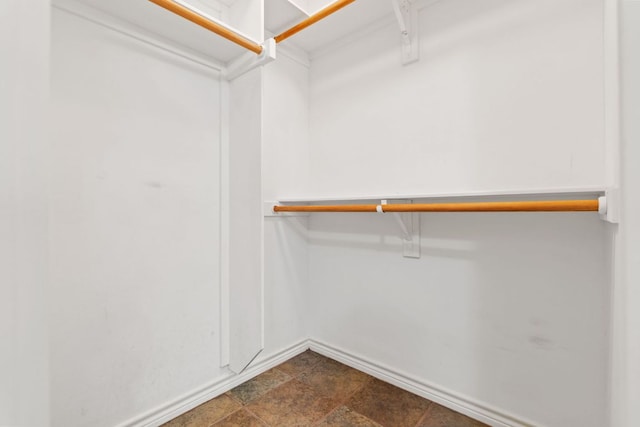 703 Amy Cir, Marble Falls, TX 78654 - spacious closet featuring dark stone finish flooring
